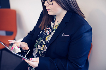 Woman holding an ipad.
